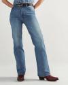 Person wearing blue jeans, a black belt, and red heeled boots, standing against a plain light background; upper body is partially out of frame.