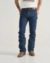 A person wearing a white T-shirt, blue jeans, a dark brown belt, and brown cowboy boots stands against a plain background.